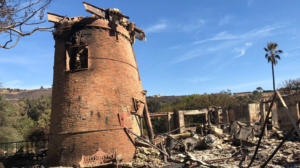 Charred remains are all that is left of the destroyed home of German TV presenter Thomas Gottschalk, Tuesday, Nov. 13, 2018, in Malibu, Calif., after the Woolsey Fire swept through. (AP Photo/Reed Saxon)
