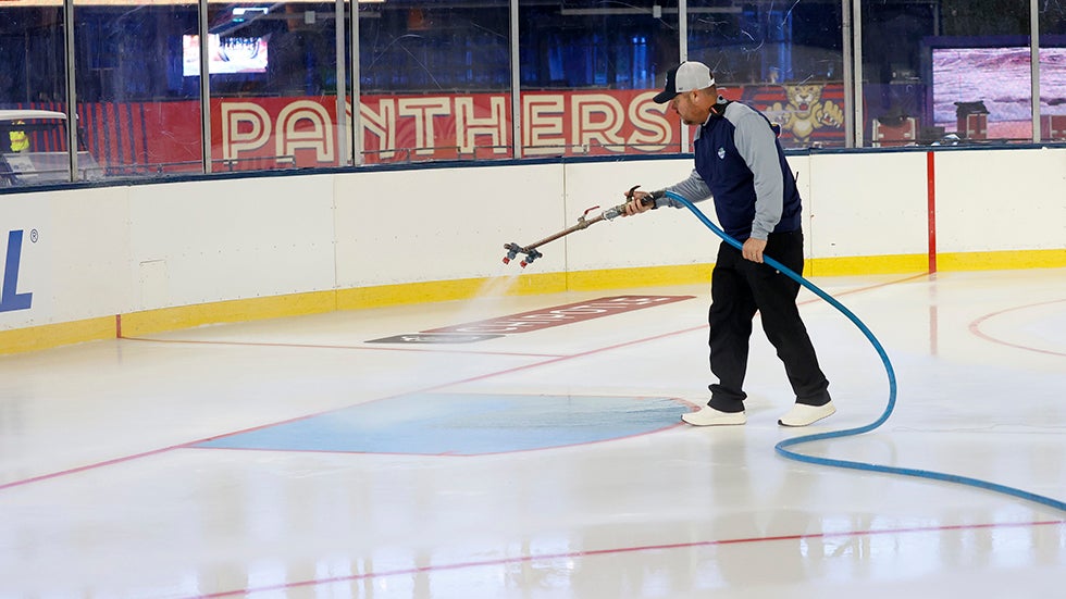 Crews sprayed fine mists of water to build up the ice for the 2026 Winter Classic rink in Miami, Florida. (Photo by Eliot J. Schechter/NHLI via Getty Images)
