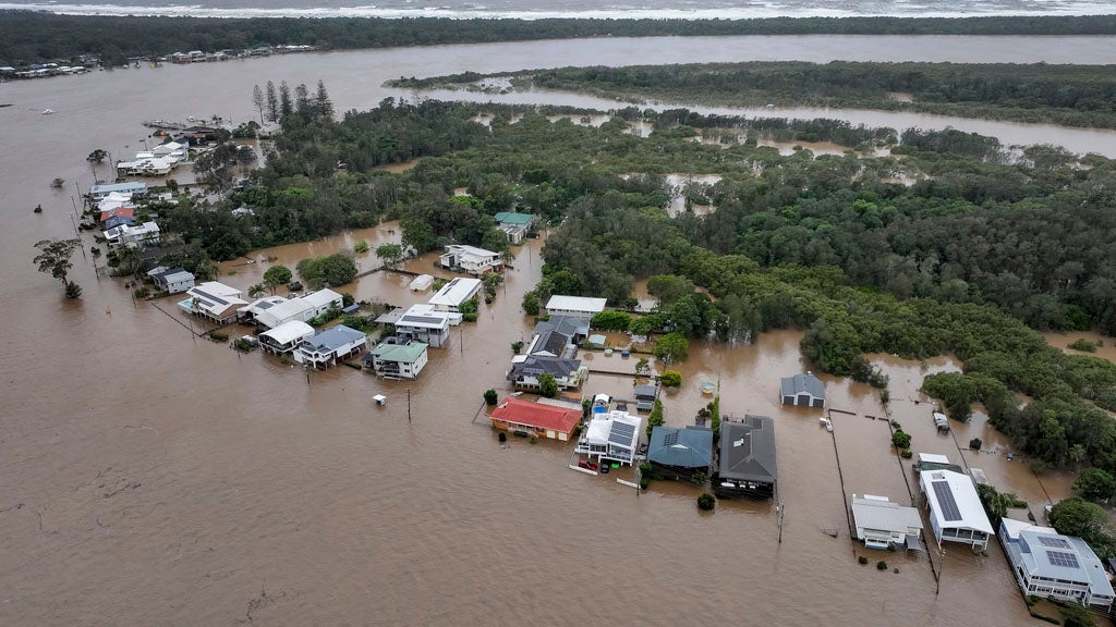 Flood waters surround houses in Port Macquarie, north of Sydney, Australia, Thursday, May 22, 2025. 