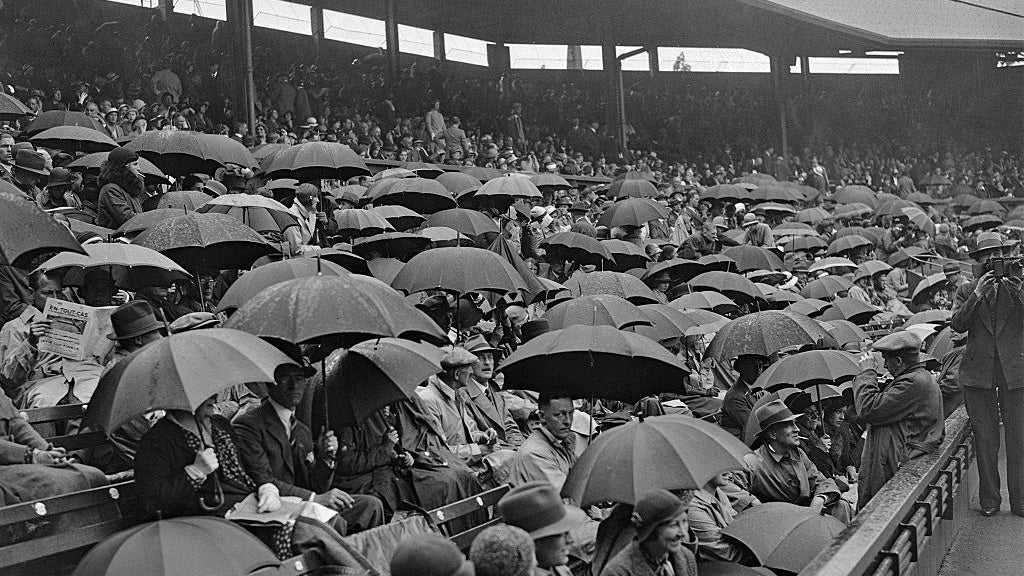 Wimbledon crowd with umbrellas out