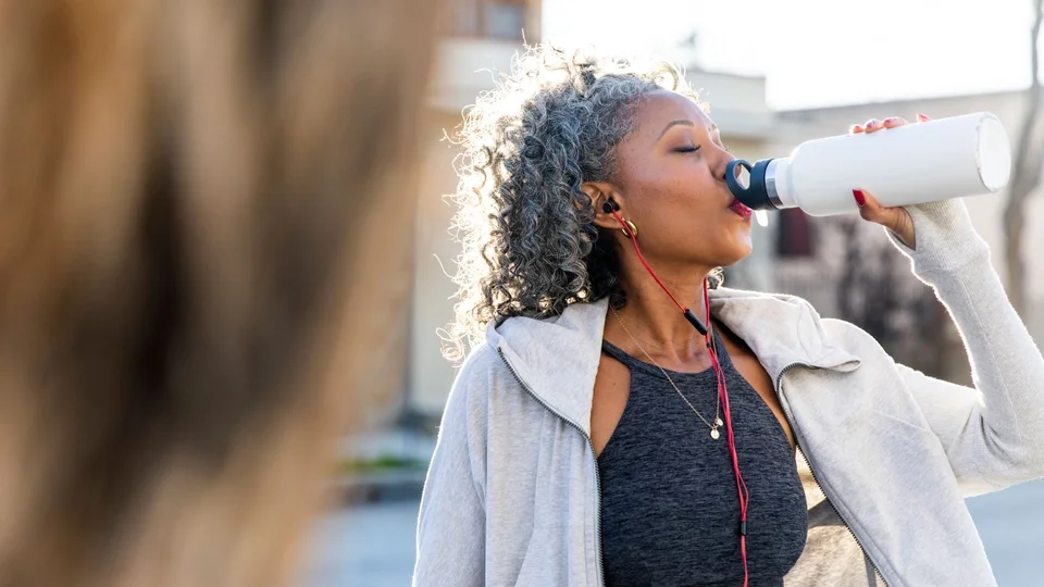 woman-drinks-more-water_getty.jpg
