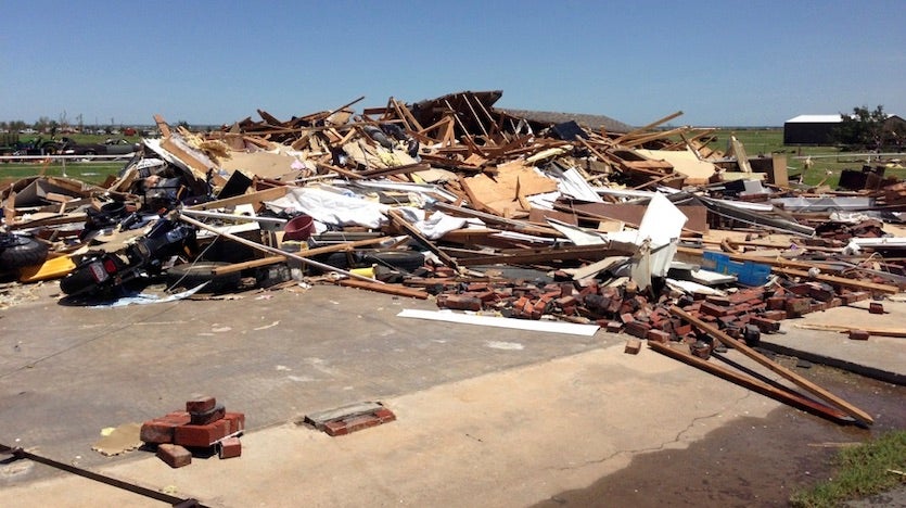 This photo shows EF3 damage from the tornado of May 31, 2013, to a house near the intersection of Rother Road and SW 15th Street, or about 6 miles south-southeast of El Reno, OK in Canadian County. All of the walls of the house collapsed. Image credit: NW