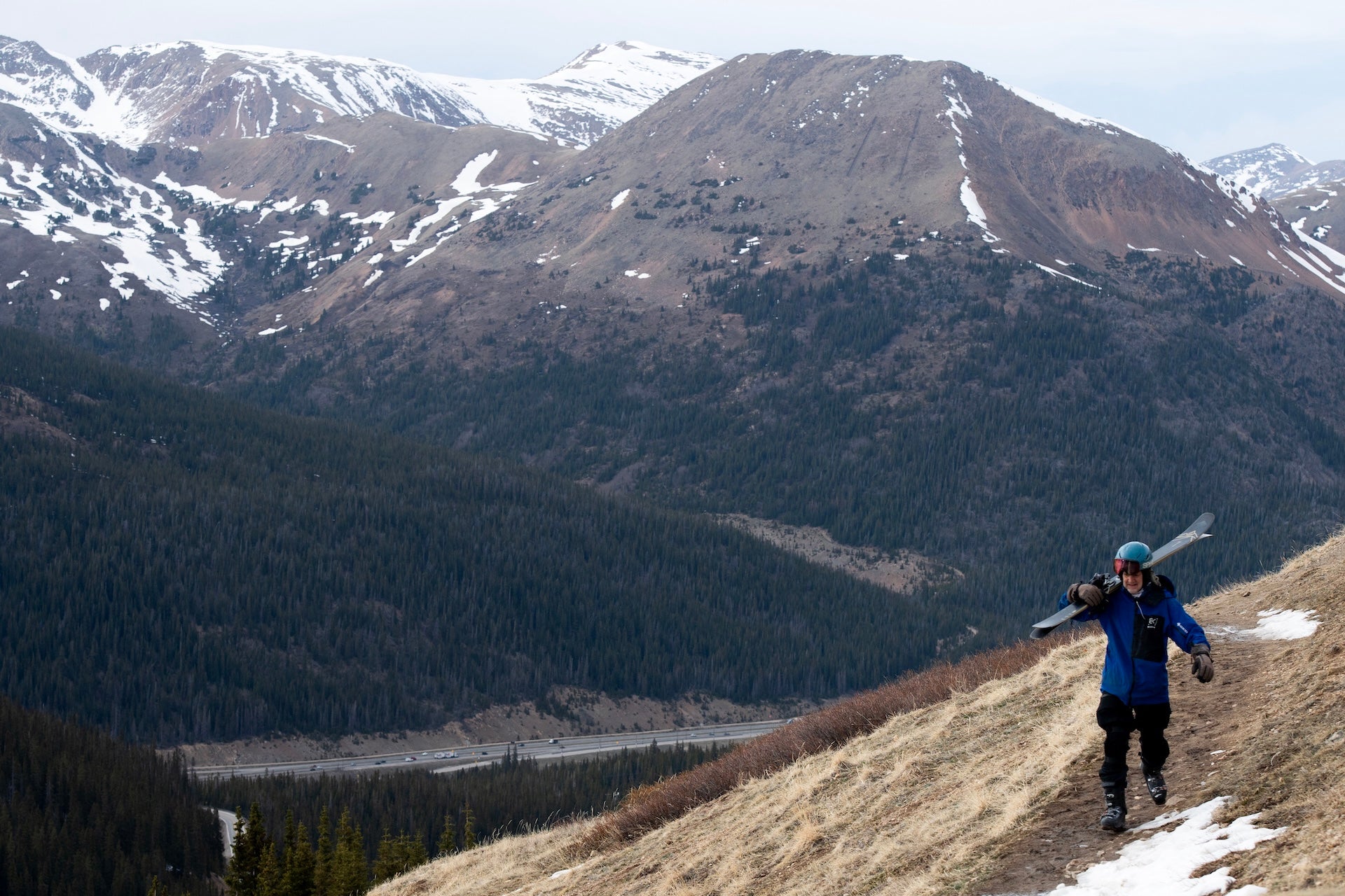 A dirt trail stretches across Loveland Pass in Colorado, on May 13, 2026, as a low snowpack leaves bare ground and parched soil for miles. 