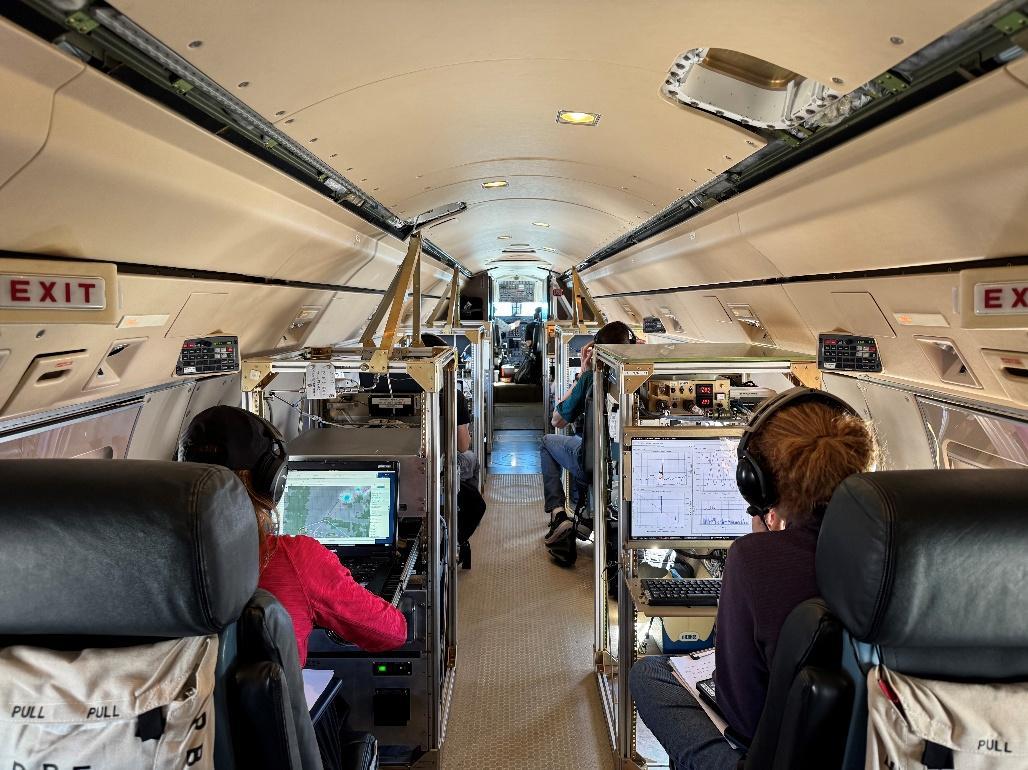Researchers monitor scientific instruments aboard the National Science Foundation (NSF) National Center for Atmospheric Research (NCAR) GV aircraft during the Injected Smoke and PYRocumulonimbus Experiment (INSPYRE). 