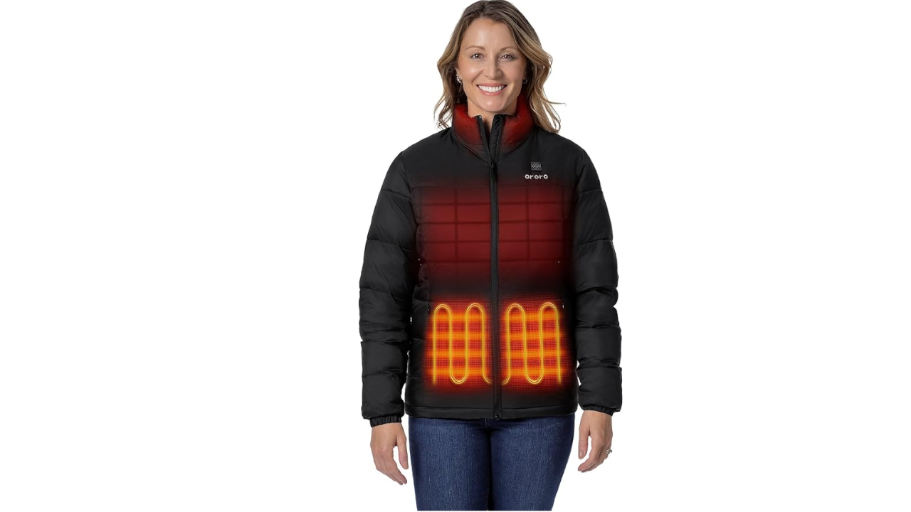 Smiling woman wearing a black ORORO heated puffer jacket with visible glowing heating elements on chest and abdomen