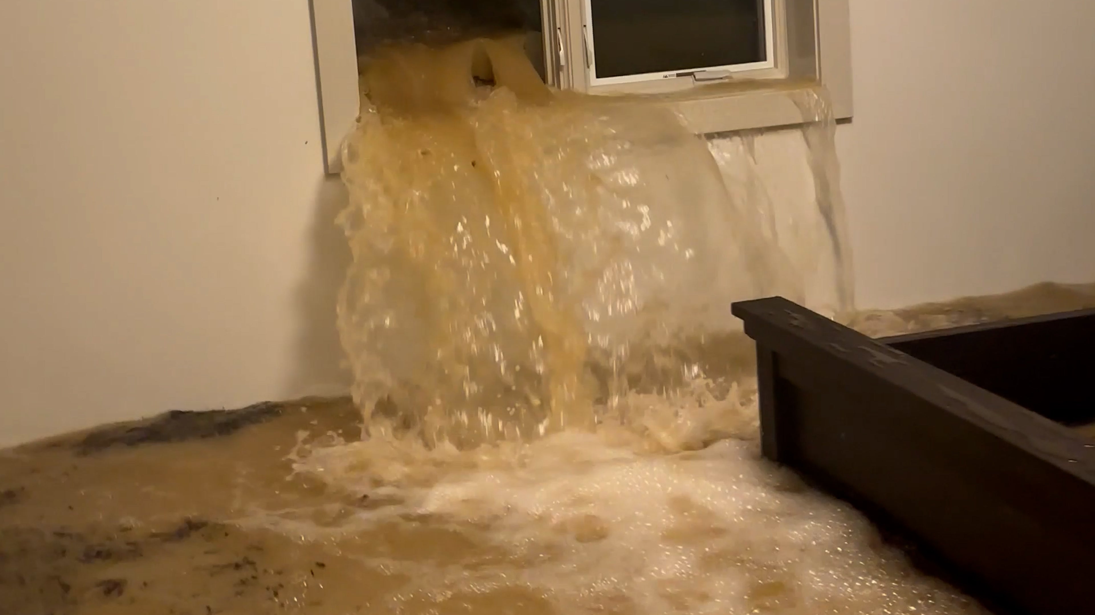 Watch: Storm shatters window, floods basement of Dayton, Ohio home