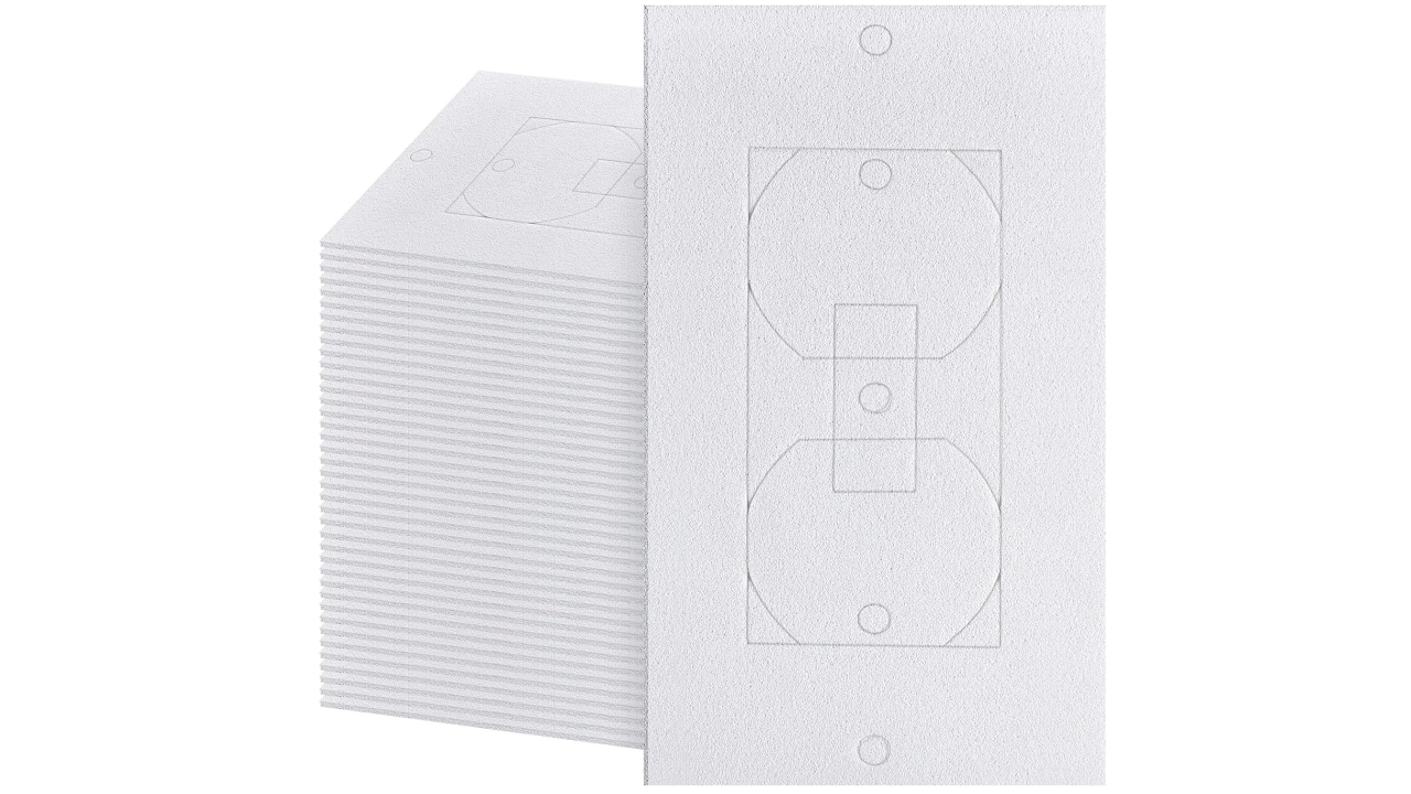 Stack of white textured foam electrical outlet cover templates with outlet outline shape