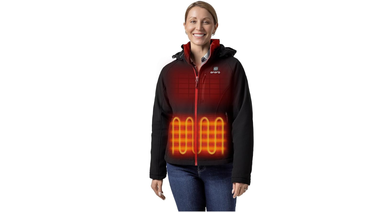 Smiling woman wearing black Ororo heated jacket with illustrated heating zones glowing orange on chest and abdomen