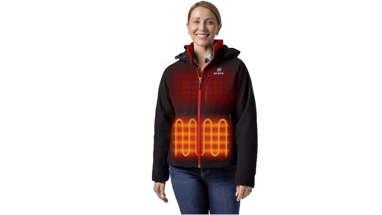 Smiling woman wearing black Ororo heated jacket with illustrated heating zones glowing orange on chest and abdomen