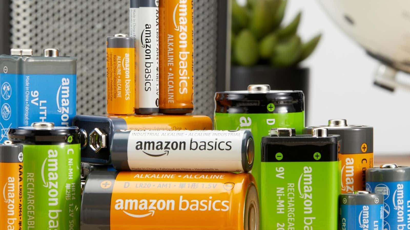 Assortment of Amazon Basics batteries in various sizes including AA, AAA, C, D, and 9V types