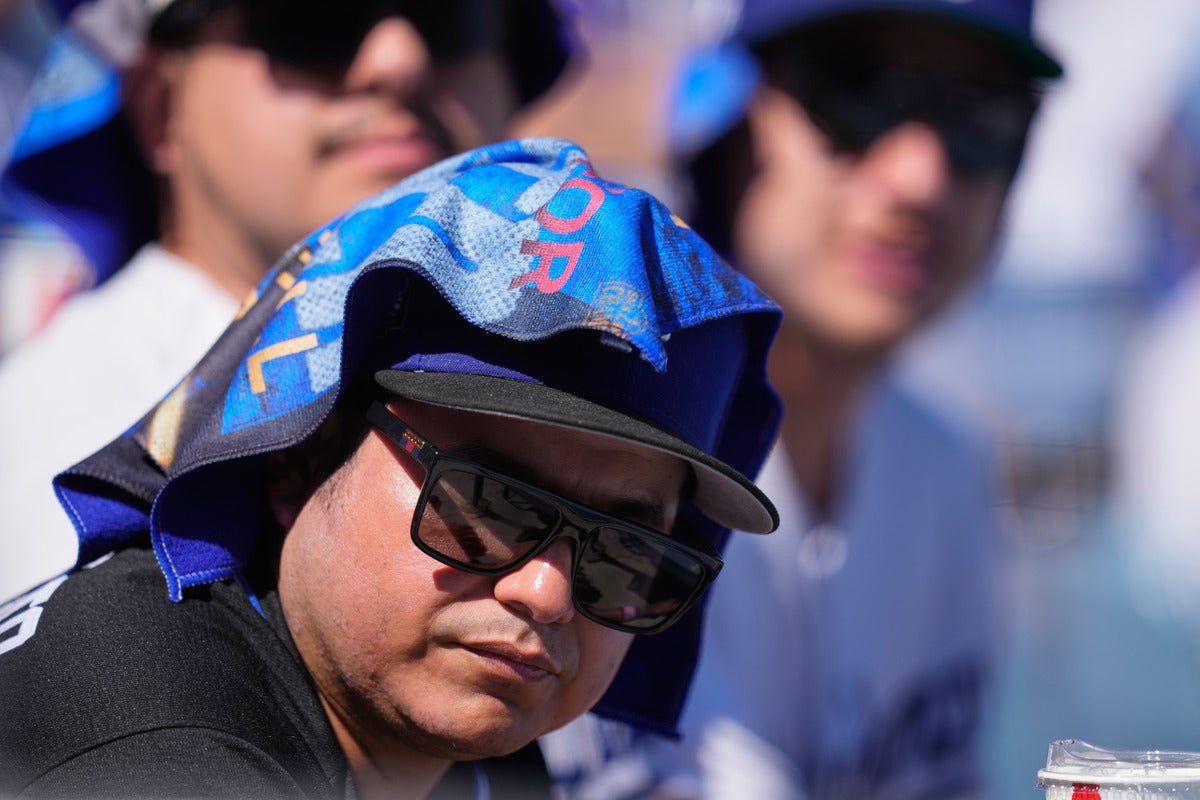 fan with towel on head