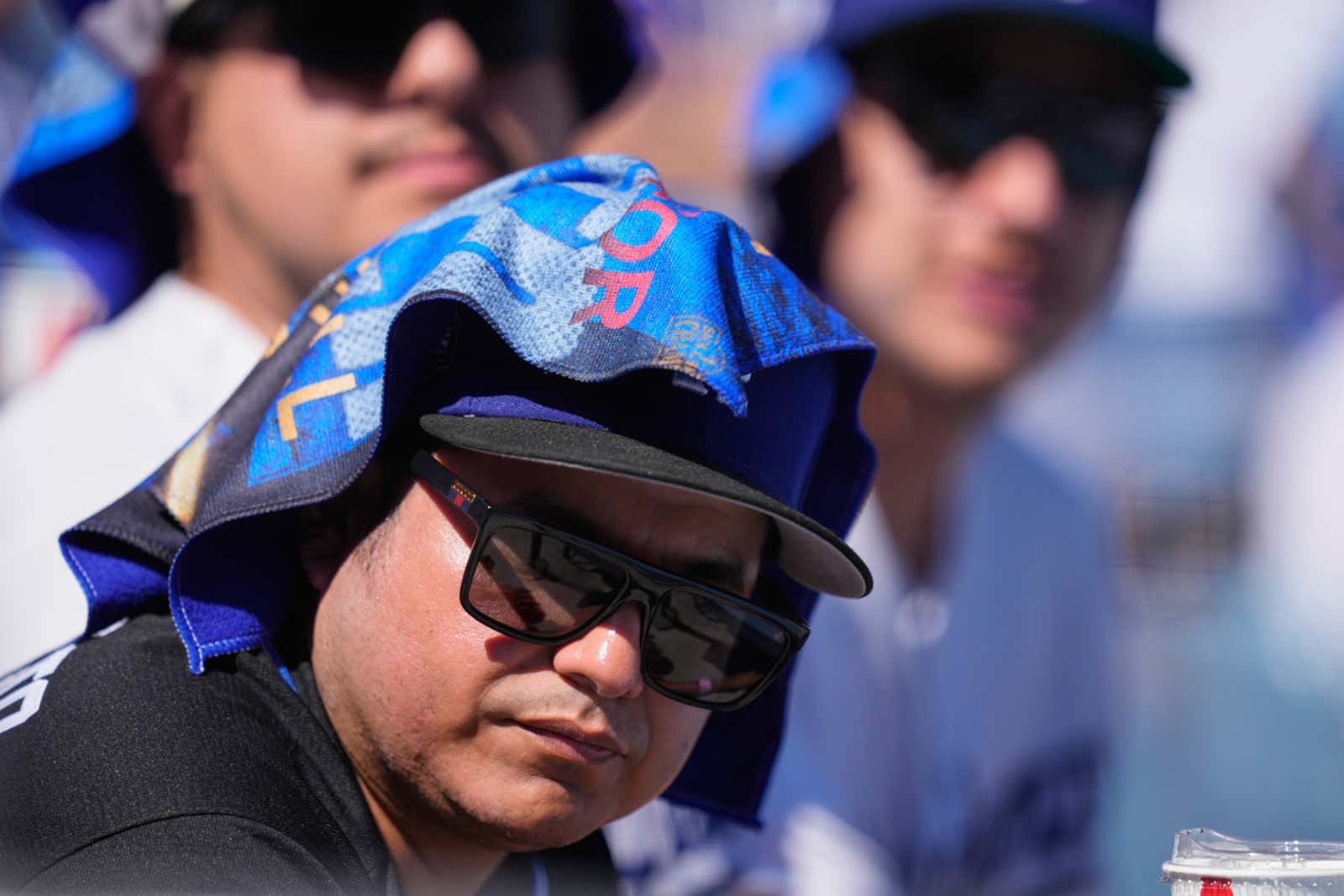 fan with towel on head