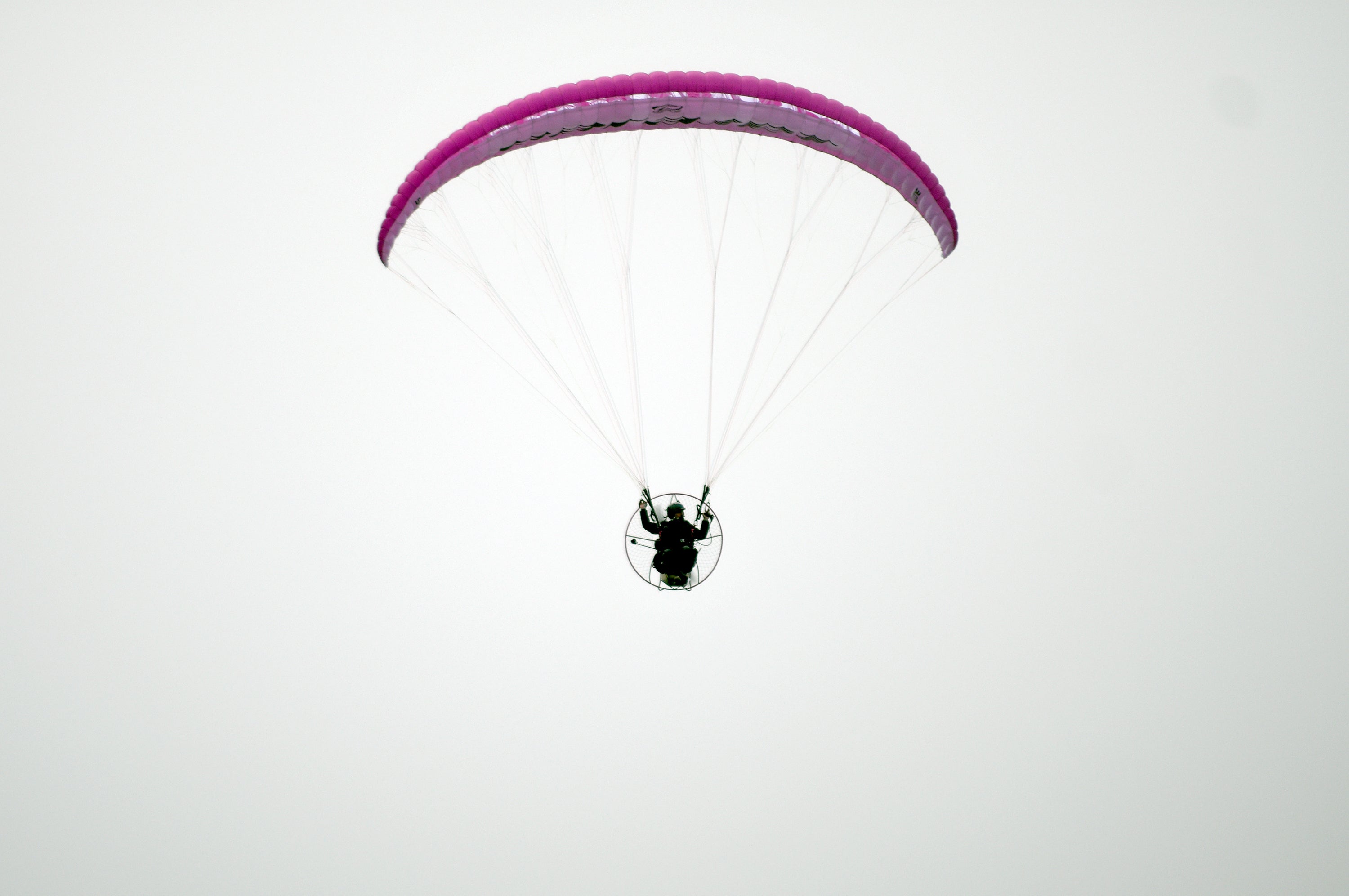 man paramotors in sky