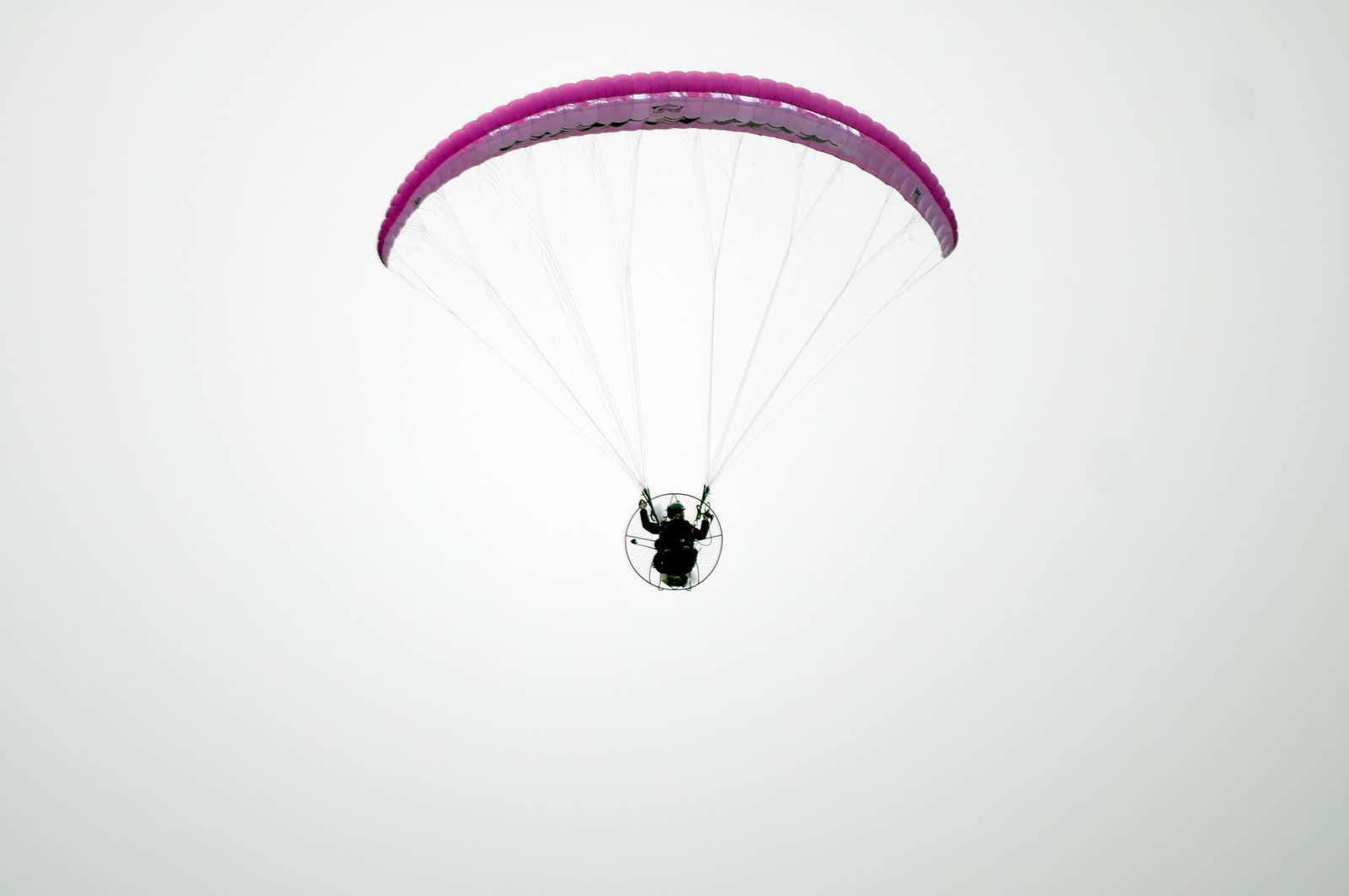 man paramotors in sky