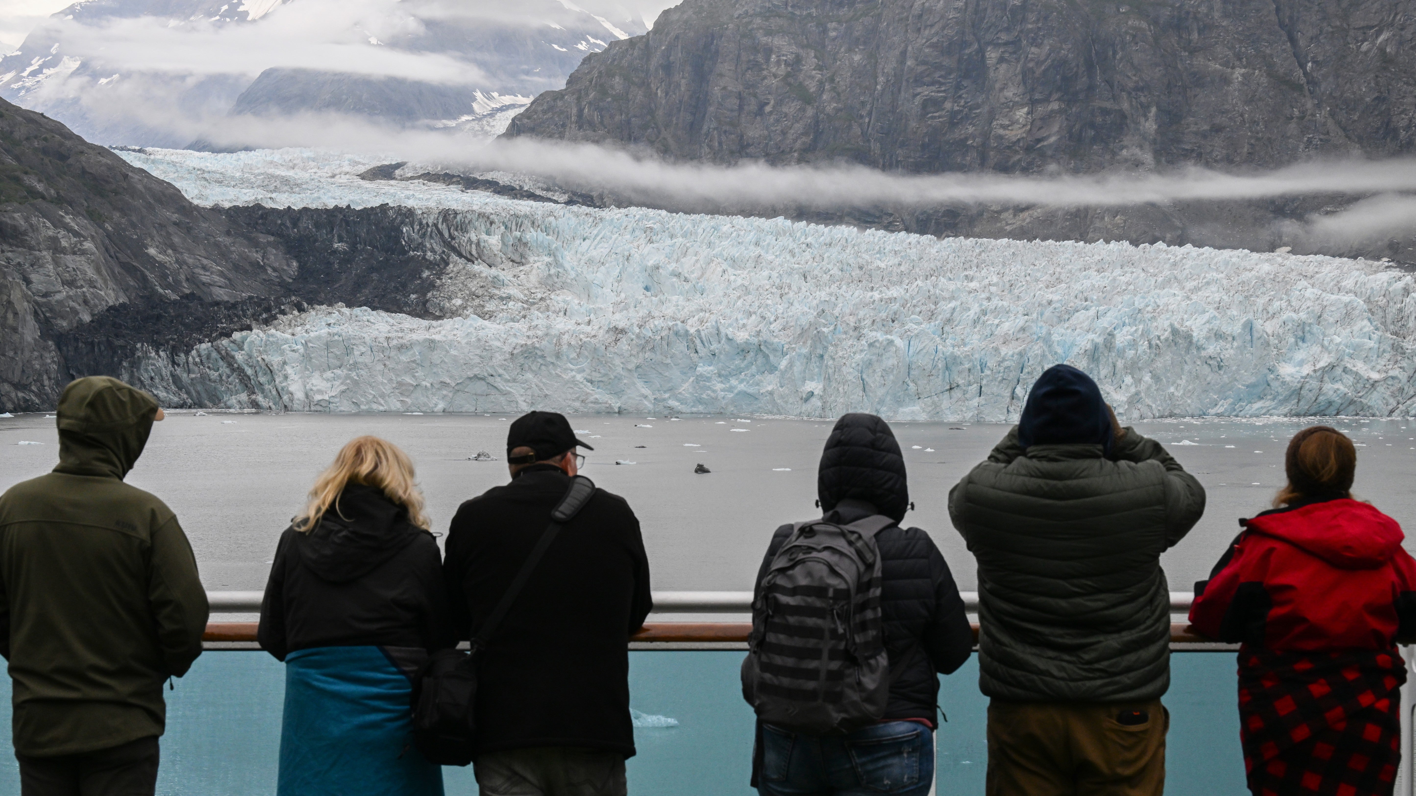 Guests onboard the Royal Princess in Glacier Bay National Park enjoy the view of the Margerie Glacier whilst on their summer vacation on August 19, 2024 in Glacier Bay, Alaska,.
