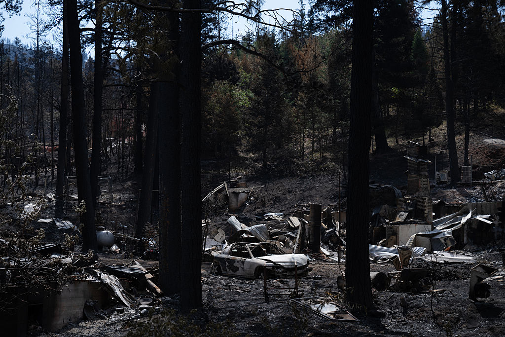 Burned car and property from the Aspen Acres fire 
