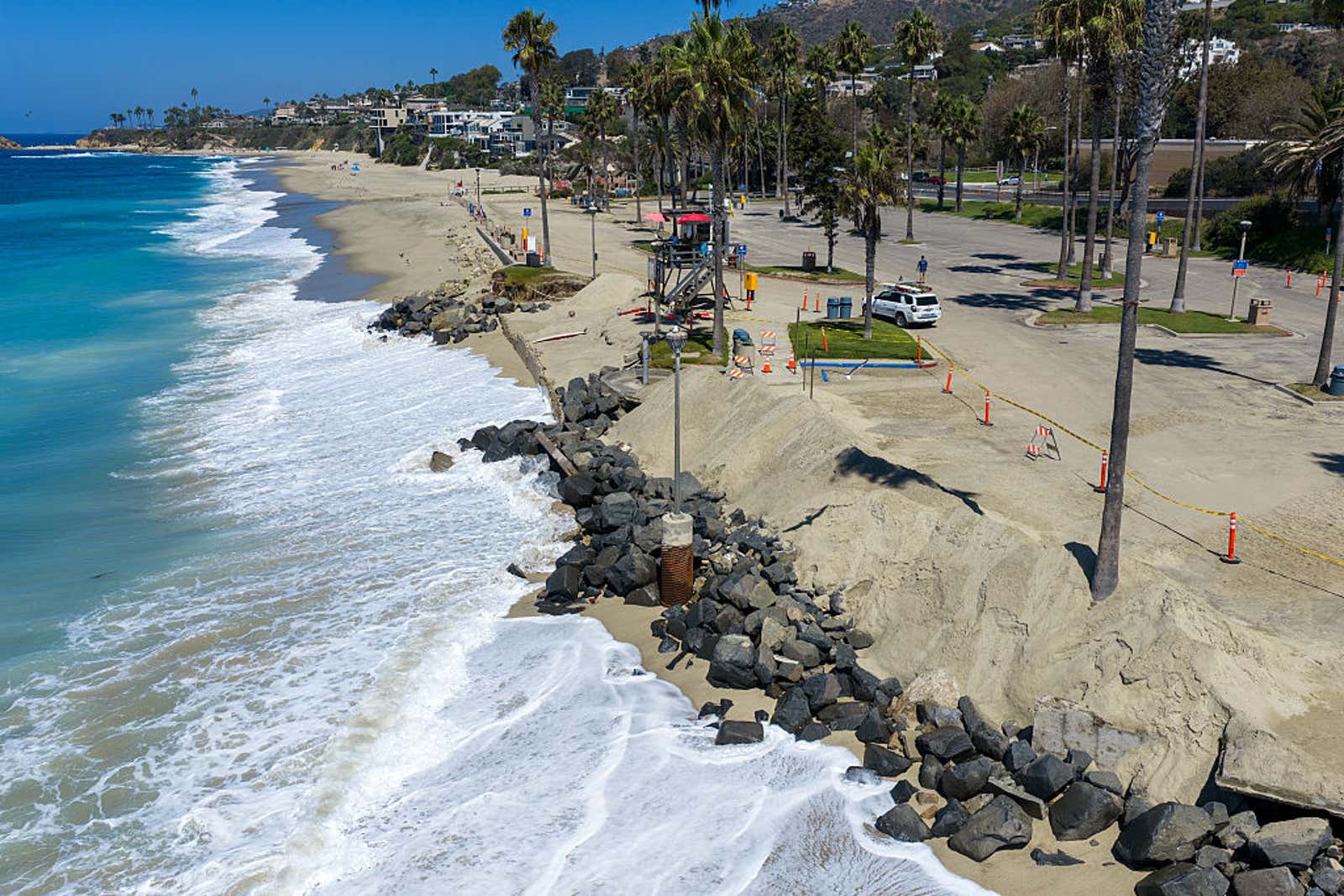 A view of the incoming tide and swell at Aliso Beach in Laguna Beach, where recent storm surges caused damage to the parking lot area and erosion, on Tuesday, Sept. 1, 2026.