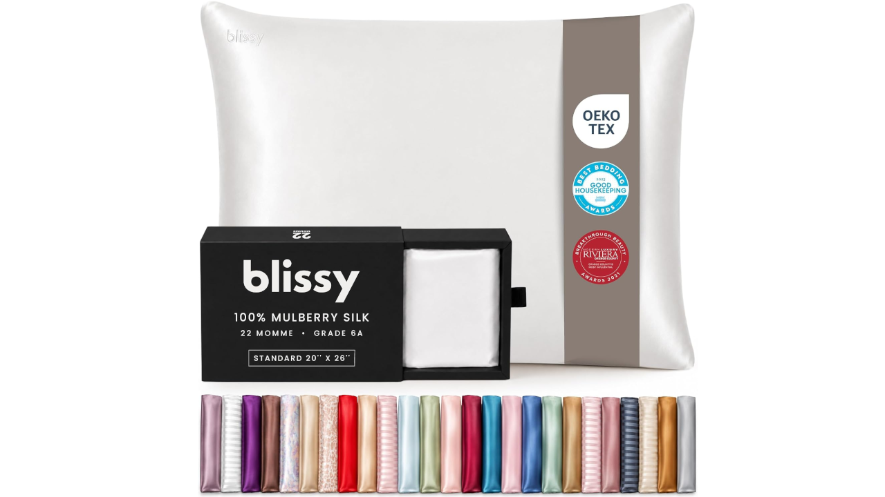 White Blissy silk pillowcase with certification badges, packaging box, and a row of color swatch samples