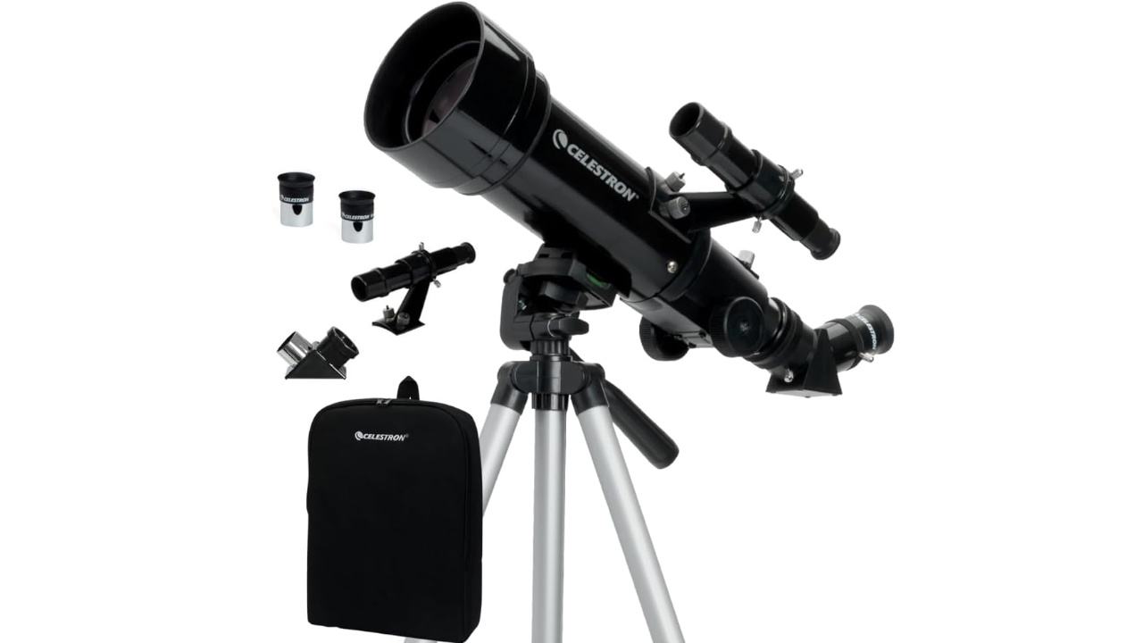 Celestron telescope on a tripod with eyepieces, finder scope, diagonal mirror, and carrying backpack