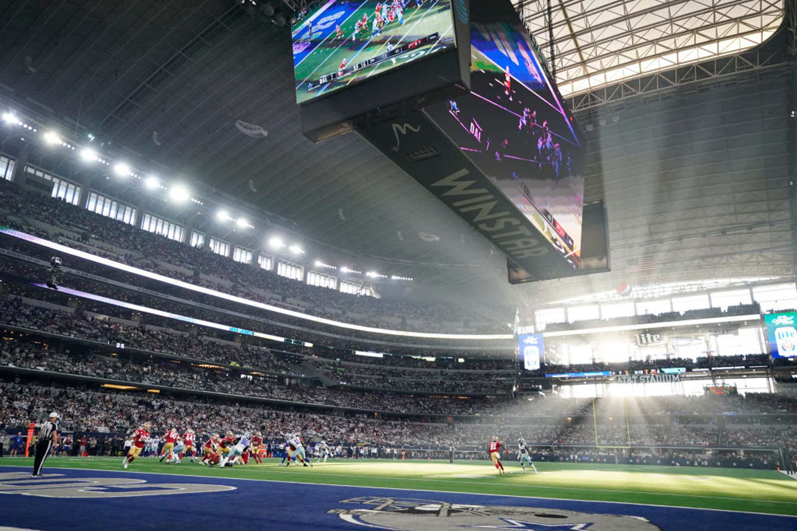 bright sun shines in football stadium