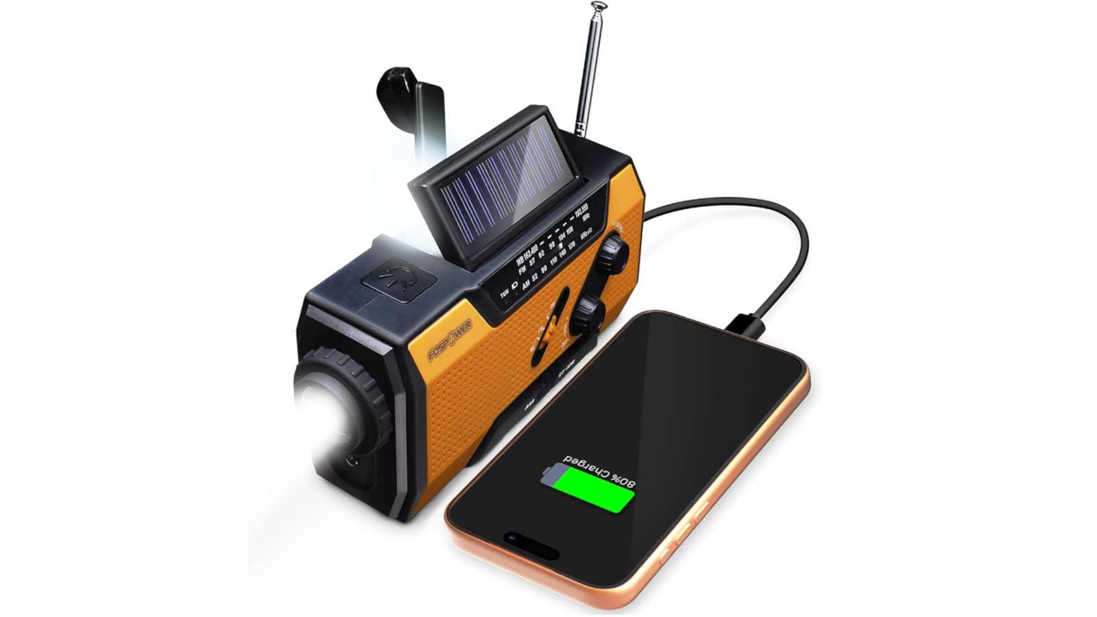 Orange and black emergency radio with solar panel, hand crank, flashlight, and antenna charging a smartphone via USB cable
