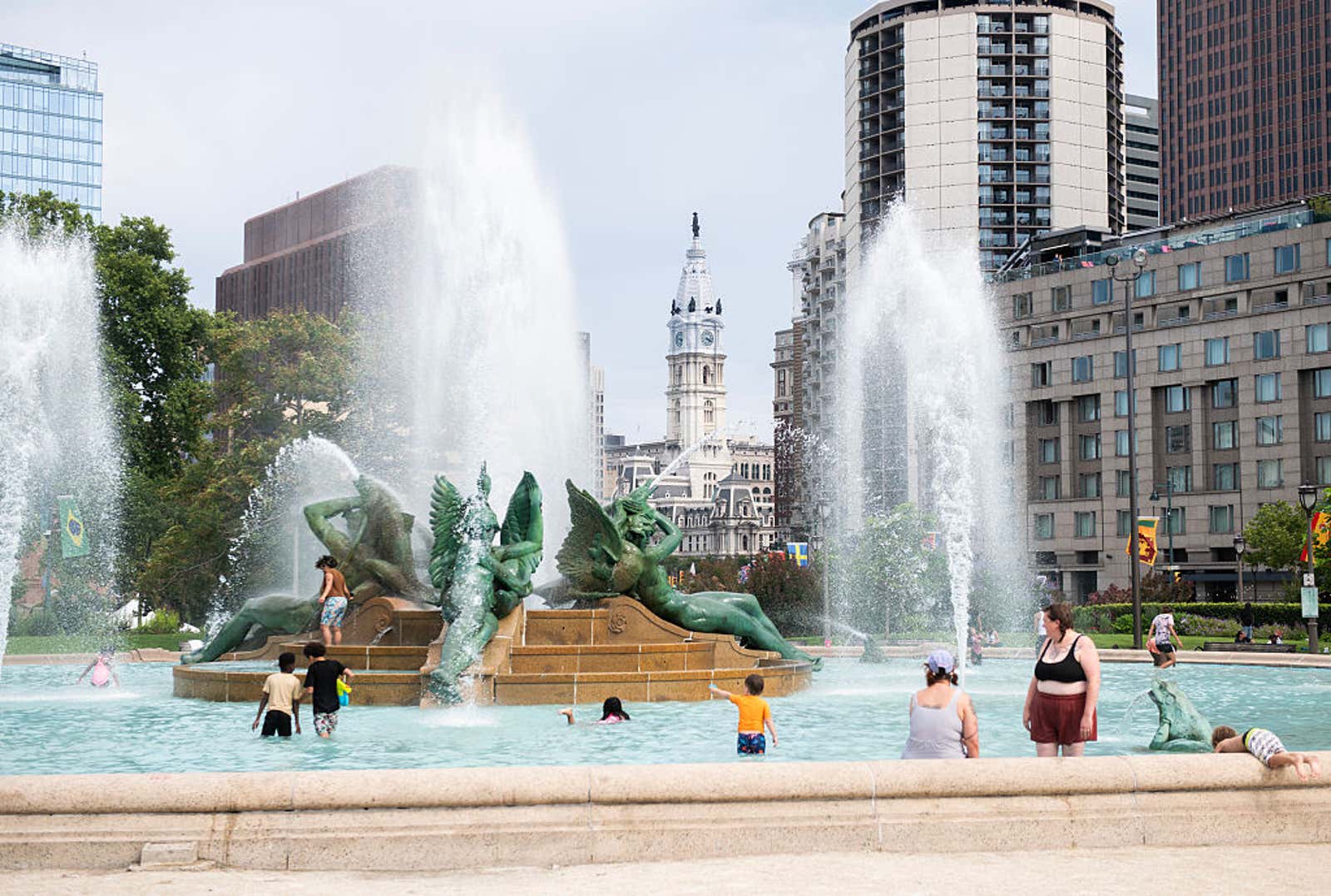 A heat dome sends families to a Center City fountain in Philadelphia, driving temperatures, and power demand, toward records.