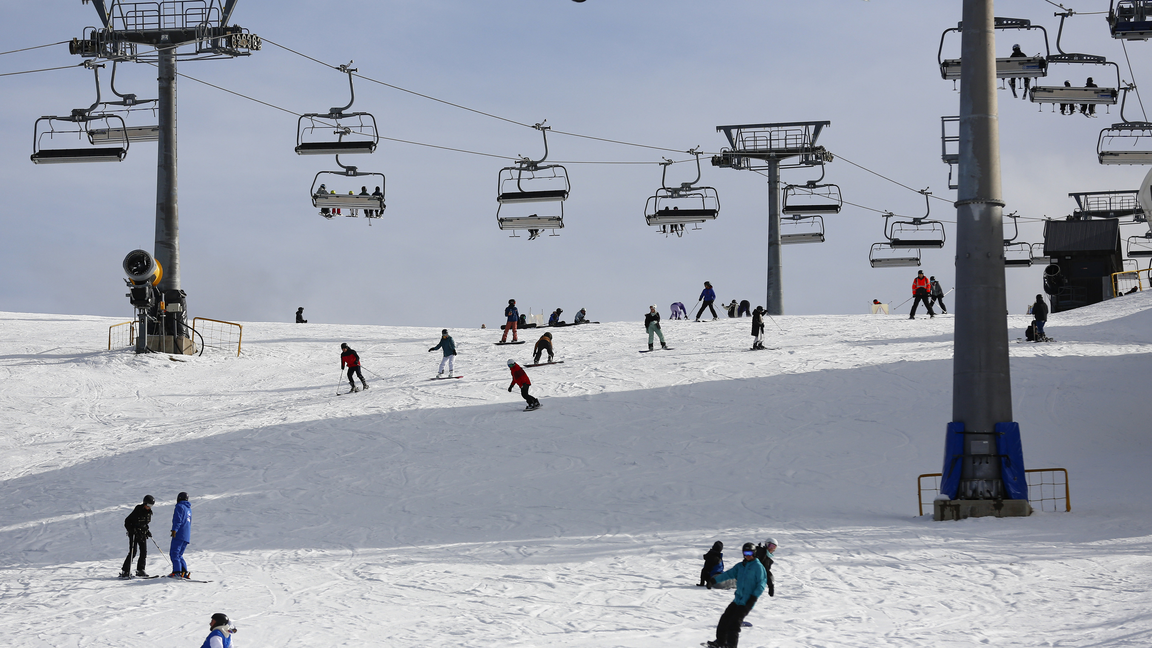 Visitors enjoy the snow at Mount Buller Ski Resort during the winter season. Mount Buller, a popular ski resort which attracts winter sports enthusiasts with its ski slopes, snowboarding runs, and picturesque snow-covered landscapes. The resort is a major destination during the Australian snow season, offering activities for both beginners and experienced skiers. 
