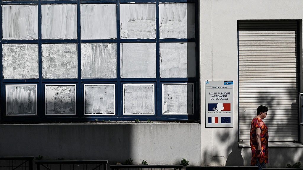 windows in a school are covered with a white chalky like substance
