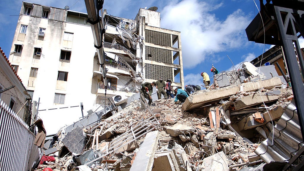 Teams conduct debris removal work on a collapsed building after an earthquake in Caracas, Venezuela, on June 25, 2026. 