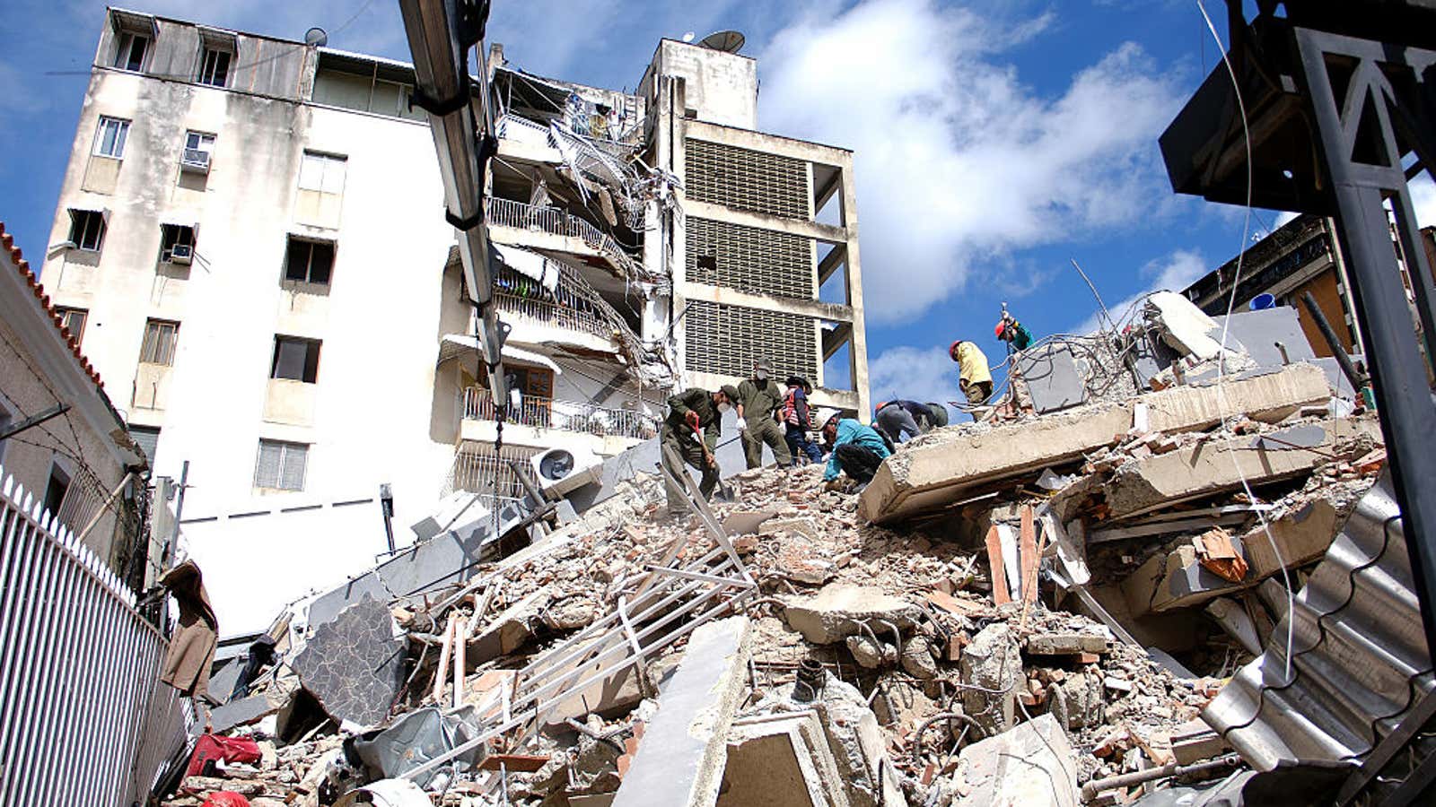 Teams conduct debris removal work on a collapsed building after an earthquake in Caracas, Venezuela, on June 25, 2026.