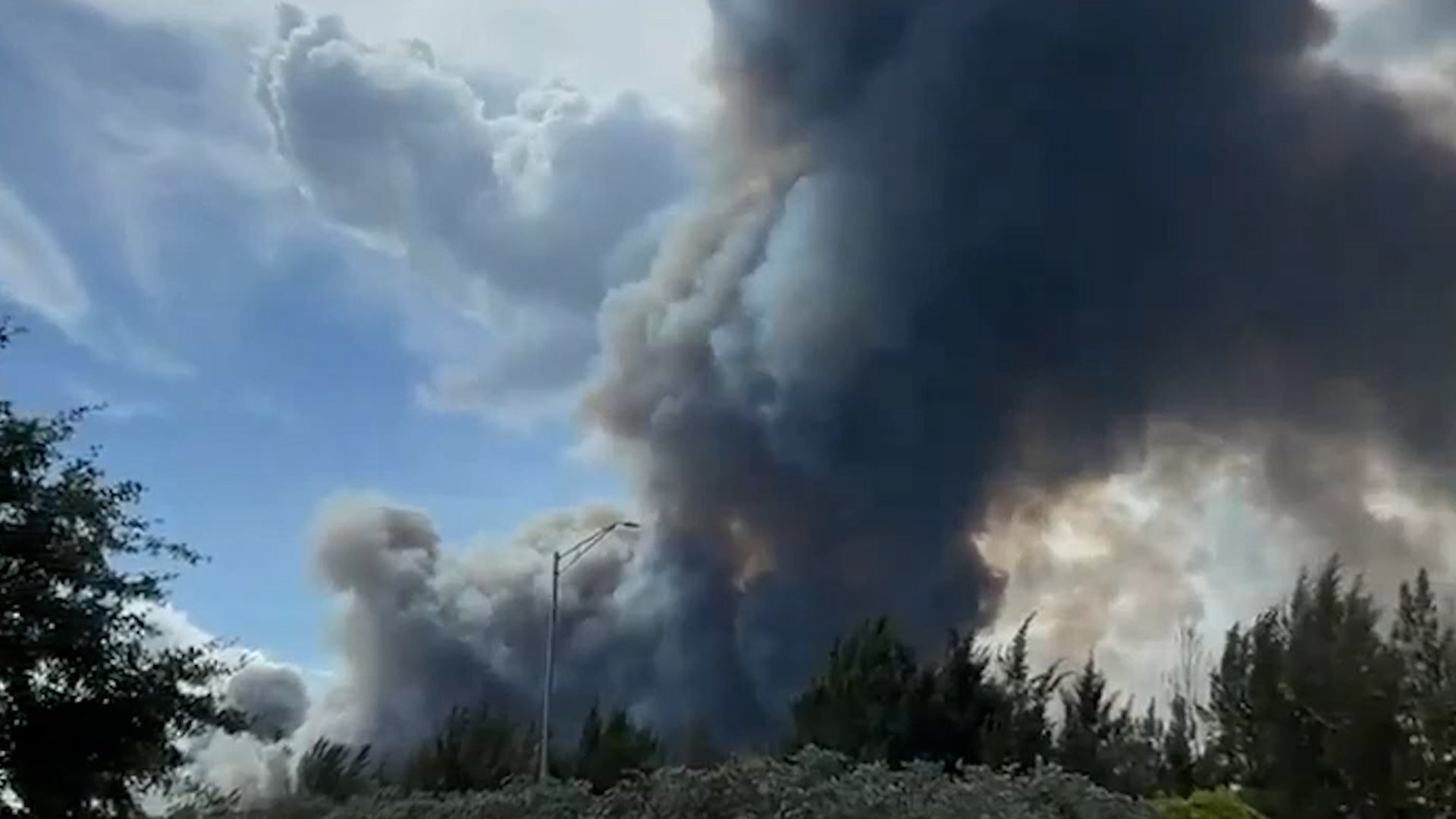 Thick smoke billows from raging Miami-area brush fire