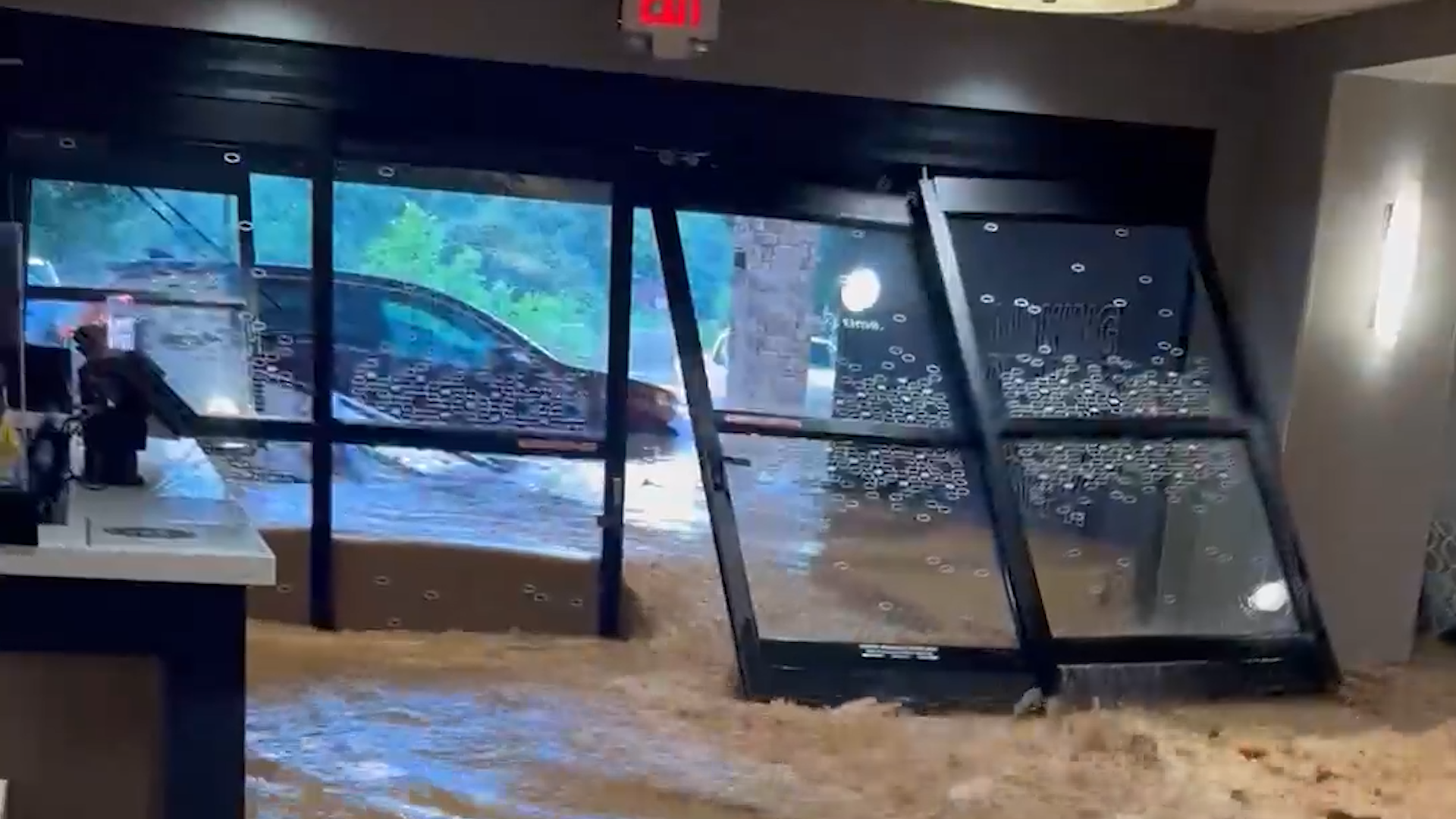 Watch: West Virginia hotel lobby swamped as floods kill 2
