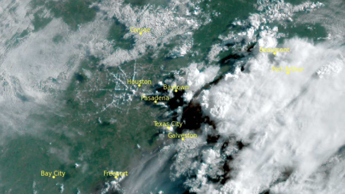 Satellite image showing clouds over the Texas Gulf Coast with labeled cities including Houston, Galveston, and surrounding areas