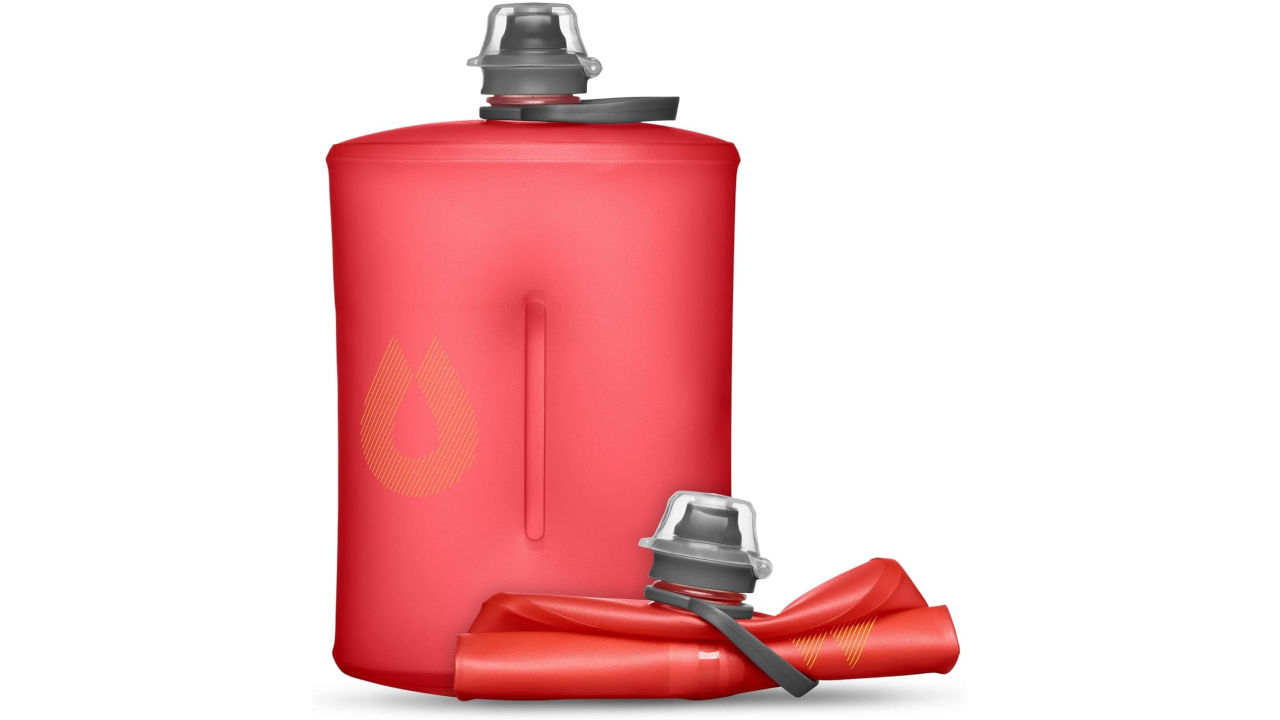 Red collapsible water bottle with silver cap standing upright next to the same bottle rolled up flat