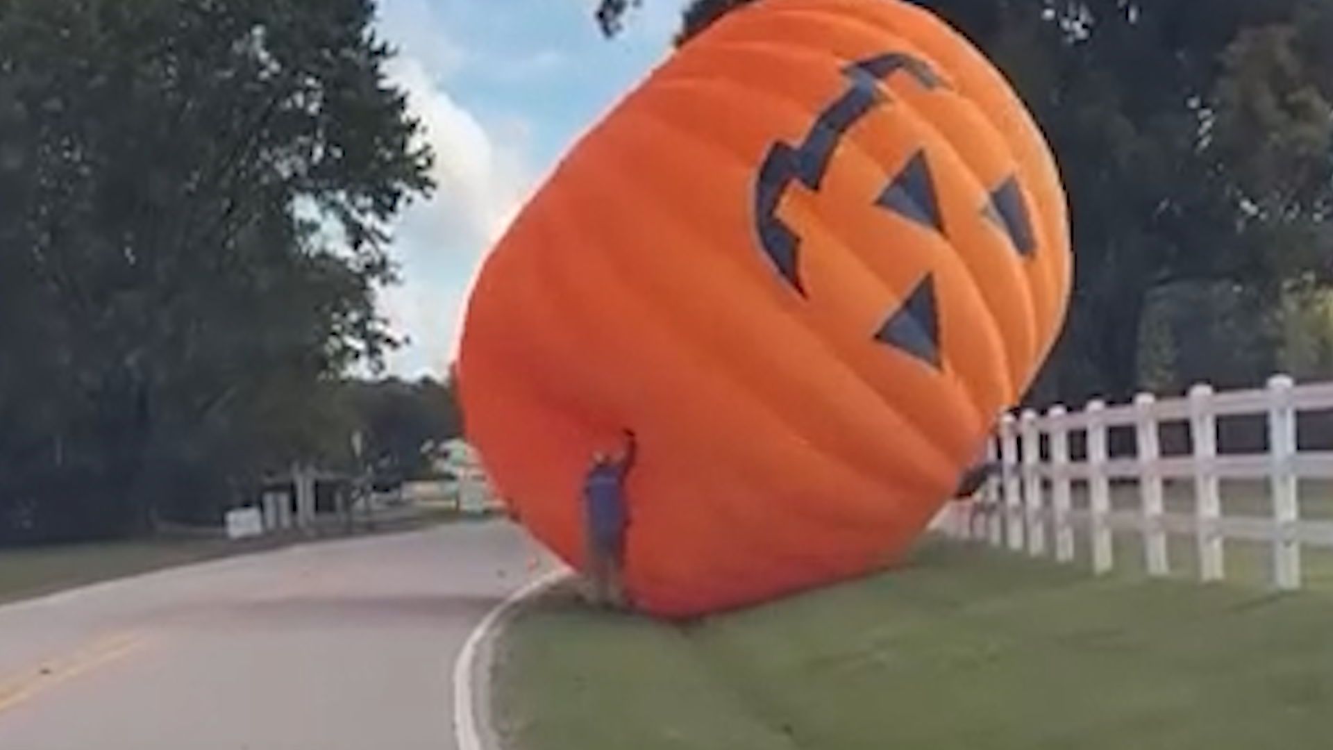 Giant inflatable pumpkin rolls down North Carolina road