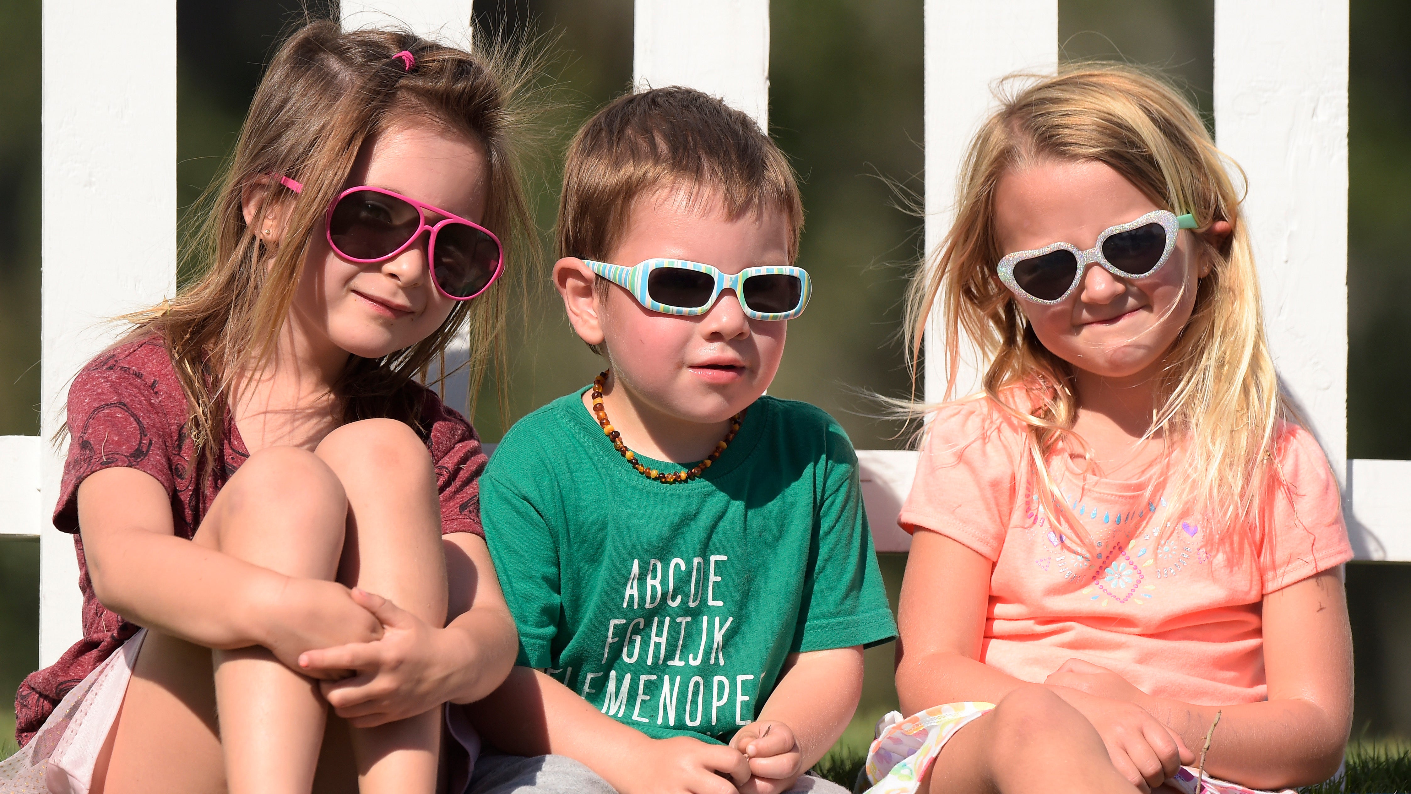 Kids wearing sunglasses prior to the start of The Players Championship at TPC Sawgrass in Ponte Vedra Beach. 