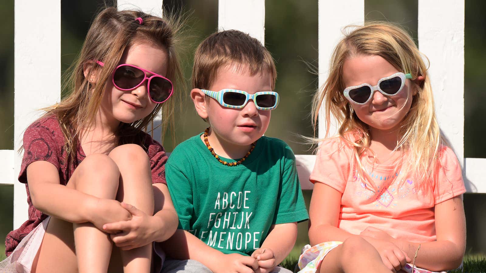 Kids wearing sunglasses prior to the start of The Players Championship at TPC Sawgrass in Ponte Vedra Beach.