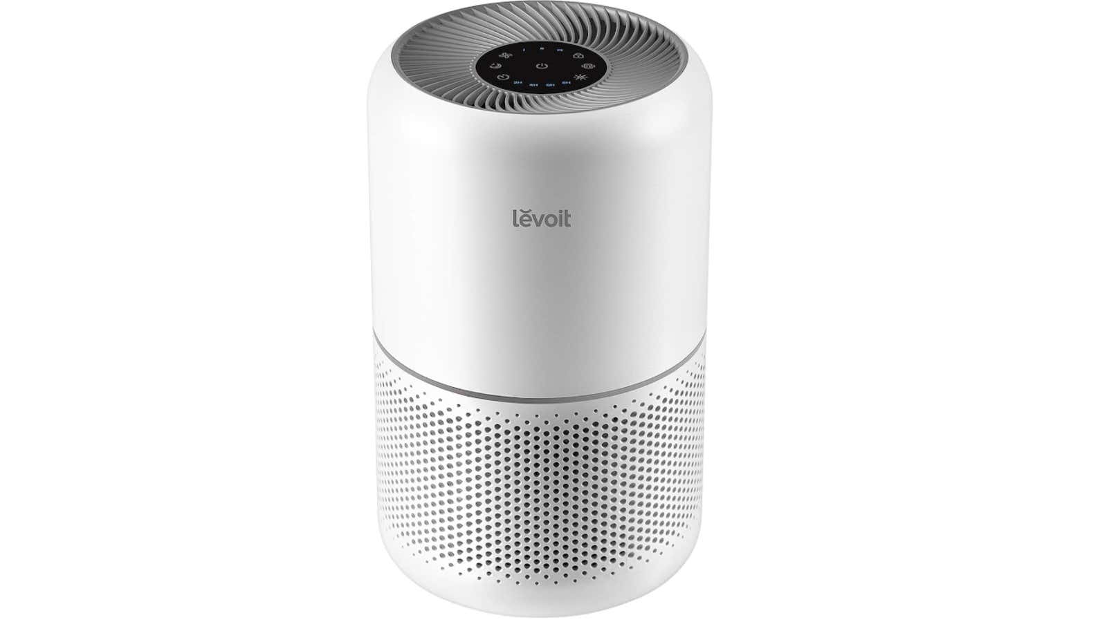 White Levoit air purifier with top control panel and perforated base on a white background