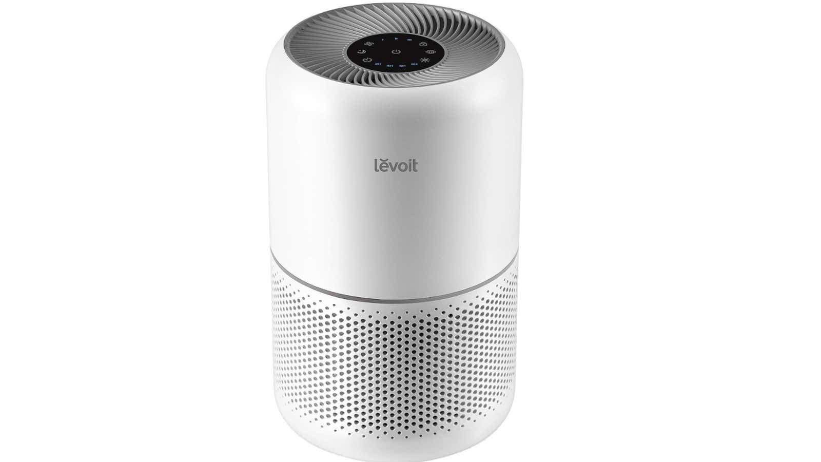 White cylindrical Levoit air purifier with circular top grille, digital display, and perforated ventilation holes on lower section