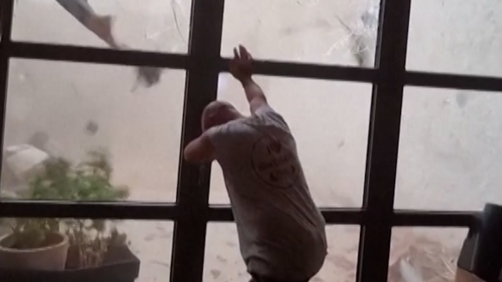 See it: Man tries to hold door shut as tornado hits Pomas, France