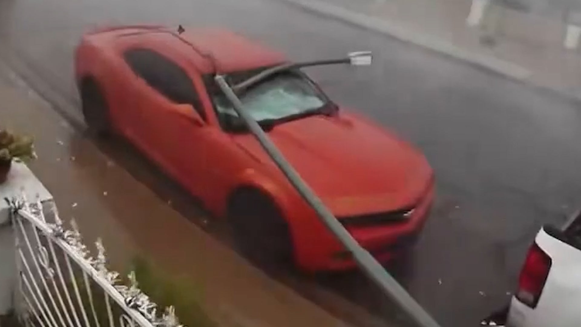 Microburst downs utility pole onto vehicles in Phoenix