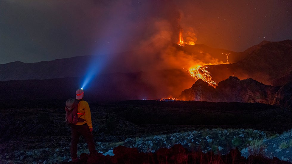 Eruptive activity continues on Mount Etna, where lava flows continue to descend on the slopes of the volcano, as seen from Mareneve near Catania, Italy, Thursday, Aug. 13, 2026.