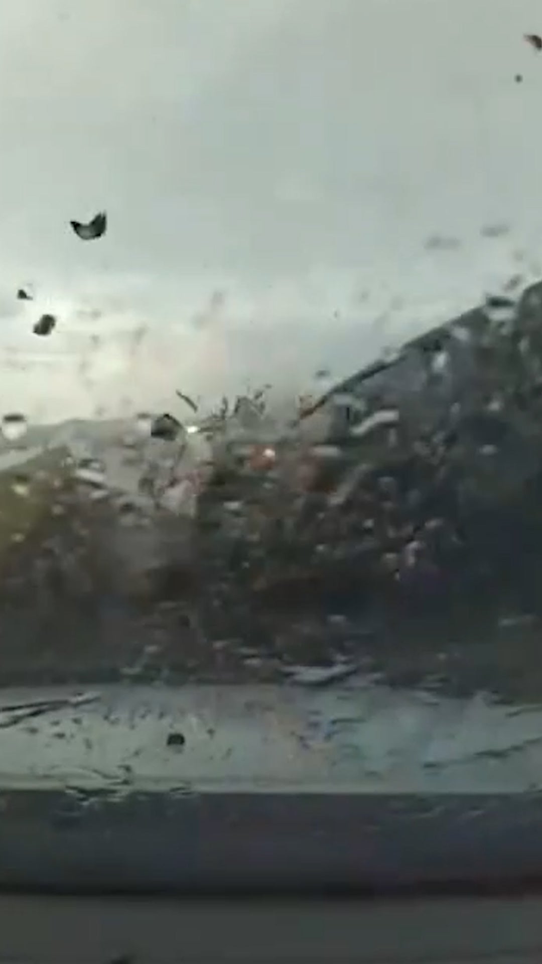 Police vehicles struck during downpour