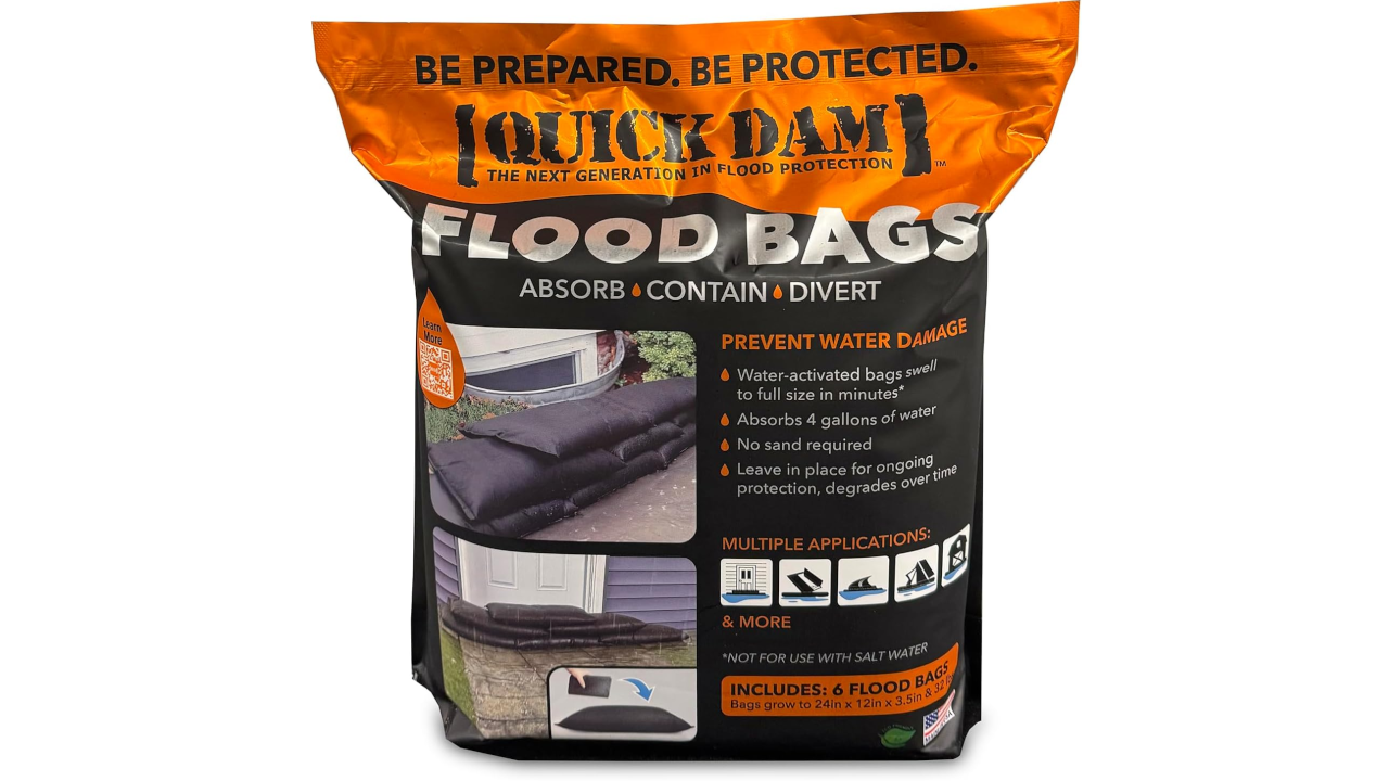 Package of Quick Dam flood bags with orange and black labeling on a white background