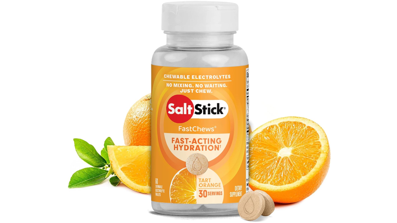 SaltStick FastChews tart orange electrolyte supplement bottle with orange slices and chew tablets