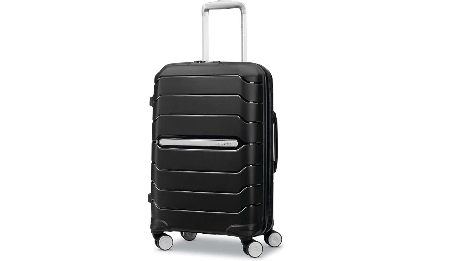 Black hard-shell suitcase with horizontal ridged design, silver telescoping handle, and four spinner wheels