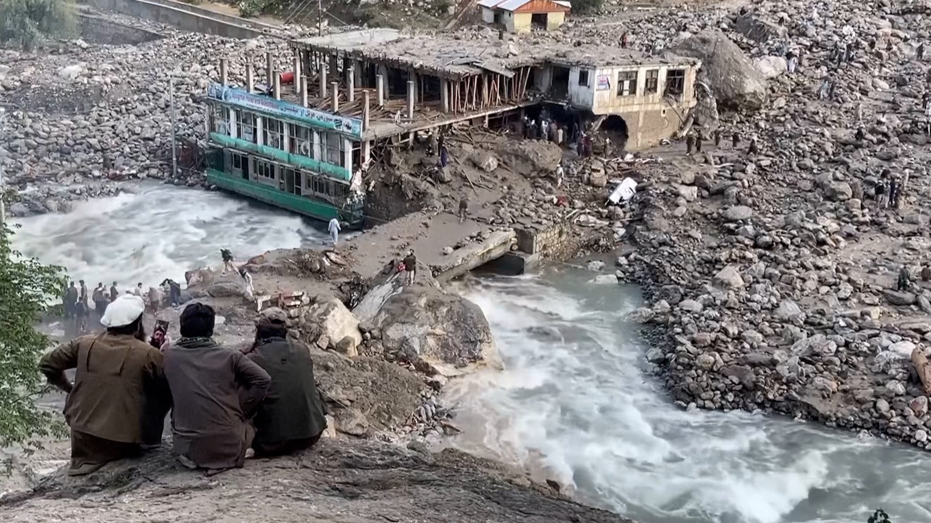 Survivors watched people get swept away in flash floods