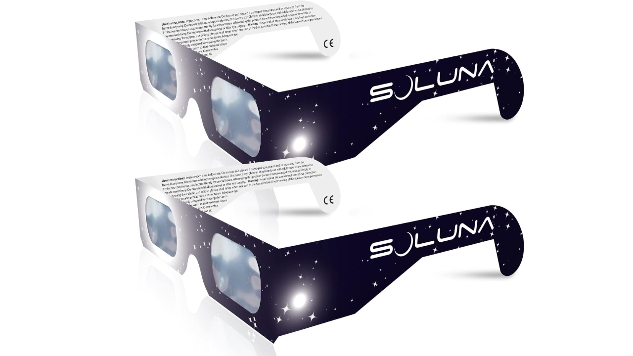 Two paper solar eclipse glasses branded "Soluna" with star-patterned frames and printed safety instructions