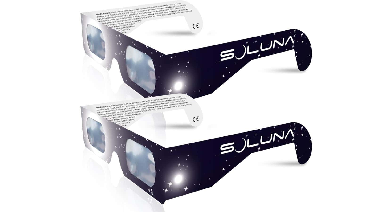 Two paper solar eclipse glasses branded "Soluna" with star-patterned frames and printed safety instructions