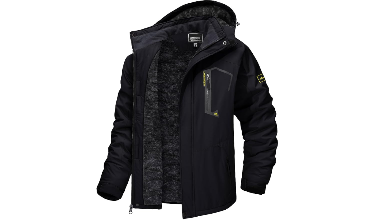 Black hooded outdoor jacket with fleece lining, zip pockets, and yellow logo patch on sleeve